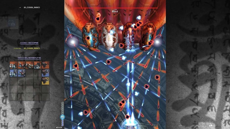 A spaceship blasts an enemy ship while absorbing blue energy in Ikaruga