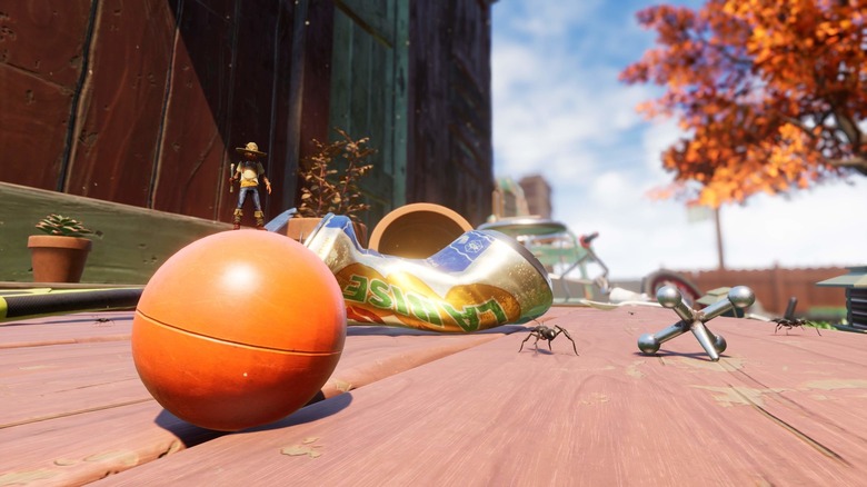 A character in Grounded standing on a ball with a spider in the background