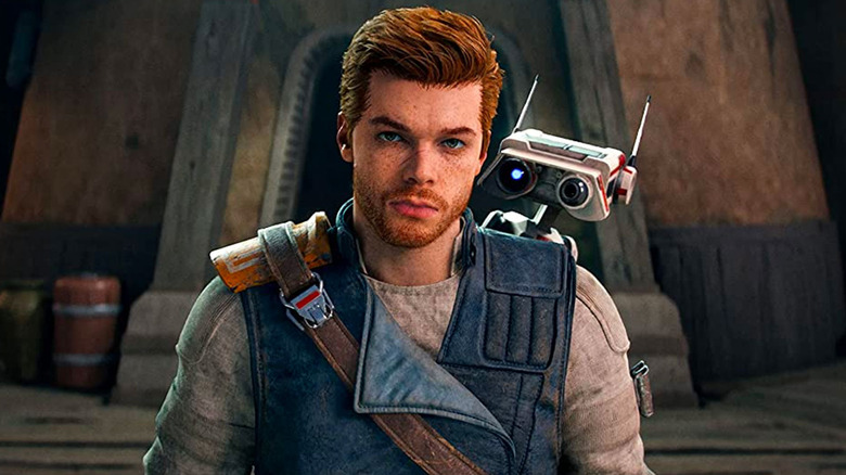 Cal Kestis stands sullenly with BD-1 on his back in Star Wars Jedi: Survivor