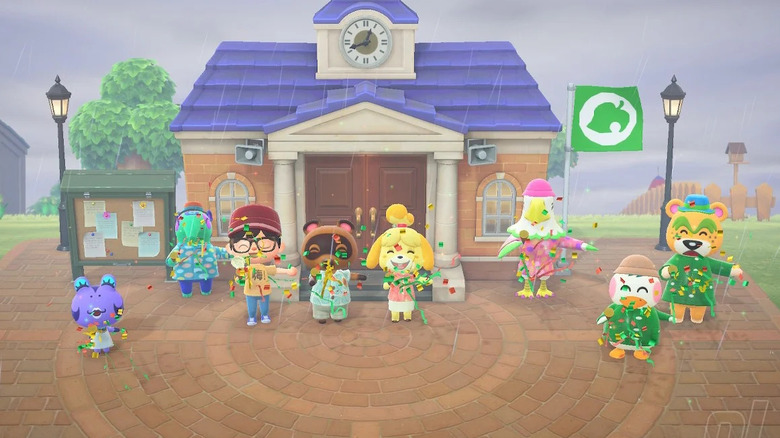 The villagers celebrate in a town square with confetti in "Animal Crossing: New Horizons" (2020)