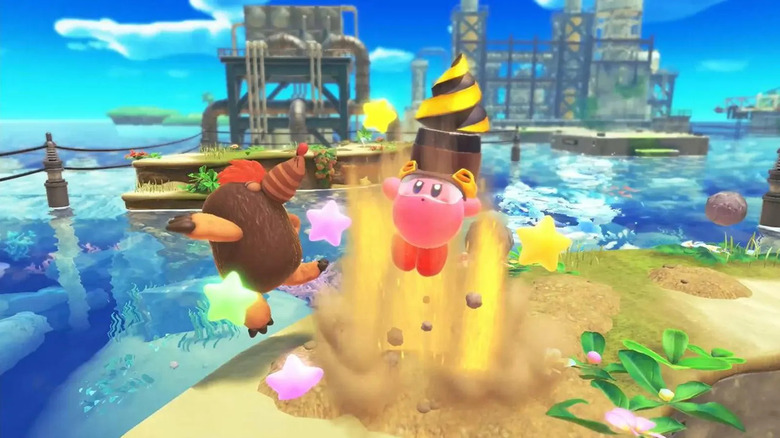Kirby with a drill helmet emerges from the sand hitting a mole in Kirby and the Forgotten Land