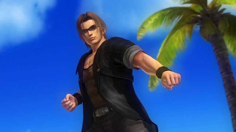 Ein strikes a fighting pose by a palm tree in Dead or Alive 5 Last Round