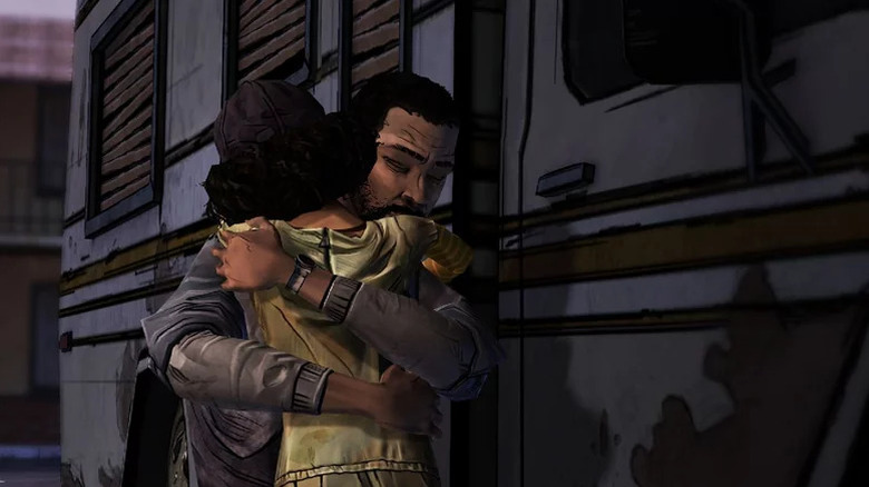 Clementine hugs Lee Everett by a trailer in The Walking Dead (2012)