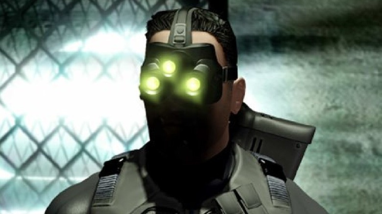 Sam Fisher stands with his night vision goggles on in the cover art for Tom Clancy's Splinter Cell