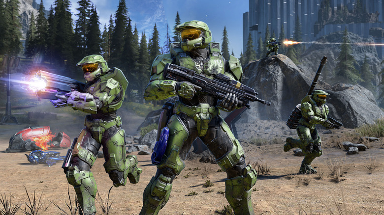 A group of Spartans charge into battle with guns blazing in Halo Infinite