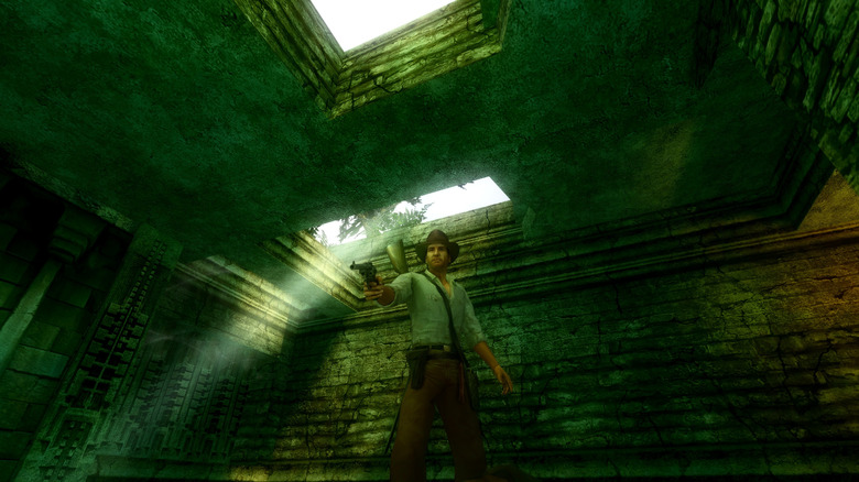 Indiana Jones aims a pistol in a sunlight tomb in Indiana Jones and the Emperor's Tomb