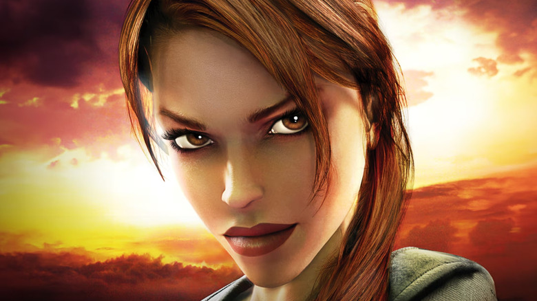 Lara Croft stares into the camera with a sunset behind her on the cover art for Tomb Raider: Legend