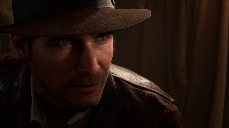 Indiana Jones peers in the shadows in Indiana Jones and the Great Circle