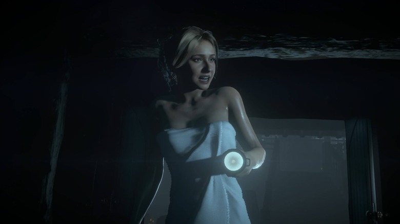Sam Giddings walks around wrapped in a towel and carrying a flashlight in "Until Dawn" (2015)