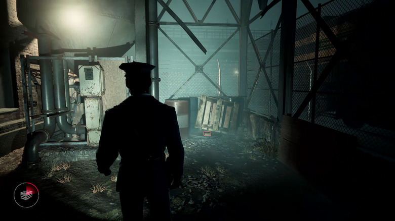 Sam Green walks through an abandoned steel mill with a flashlight in "The Casting of Frank Stone" (2024)