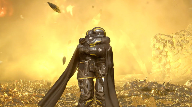 Two players hugging in the middle of a battlefield in Helldivers 2