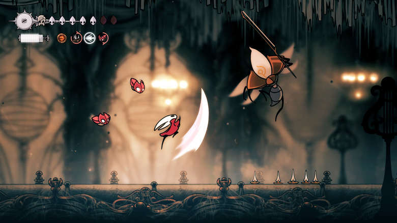Hornet lunges at a firefly wielding a sword in Hollow Knight: Silksong