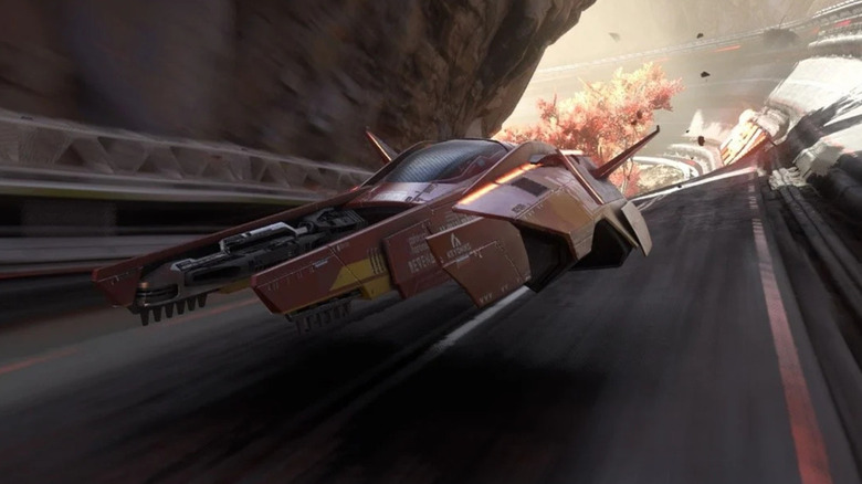 A racer turns a corner with an explosion behind them in "Fast Fusion"