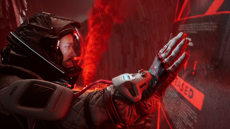 Jan Dolski touches a containment unit in "The Alters"