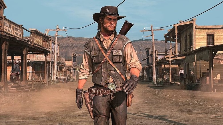 John Marston walks through a frontier town in Red Dead Redemption