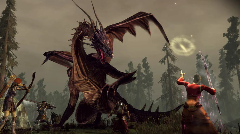 The party attacks a large dragon in a forest in Dragon Age: Origins