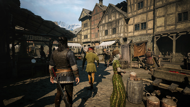 Coen standing in a marketplace in The Blood of Dawnwalker