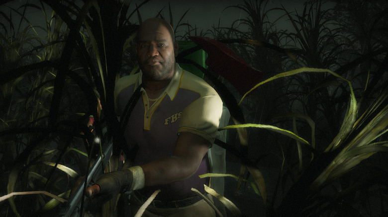 Coach walks through a cornfield while holding a gun in Left 4 Dead 2