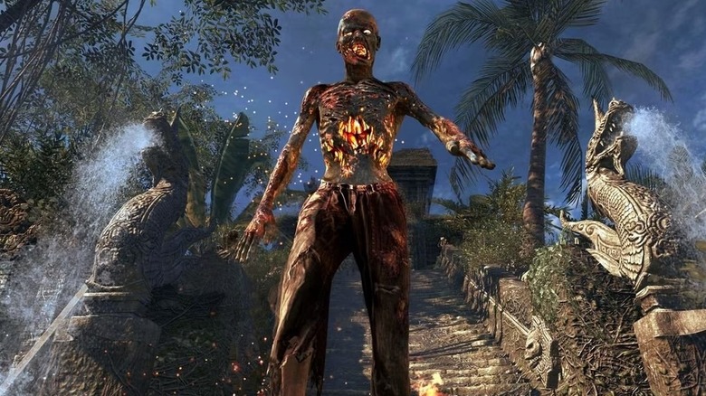 A burning zombie walks down stone steps from a temple in Call of Duty: Black Ops
