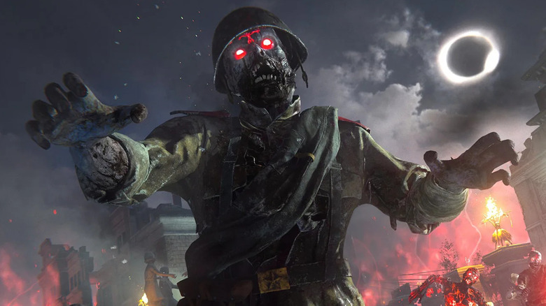 A zombie with glowing red eyes stands under an eclipsed moon in Call of Duty: Vanguard