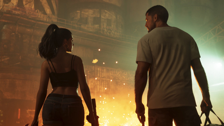 Jason and Lucia watching a car burn in Grand Theft Auto VI