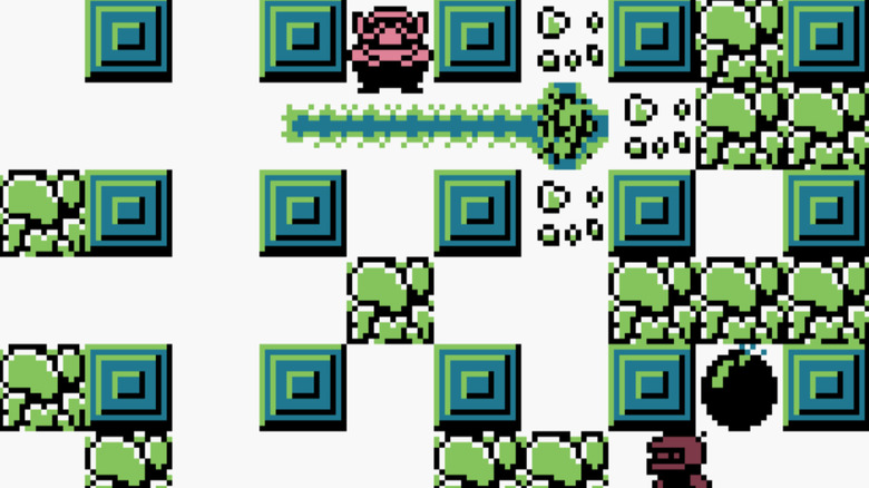 Wario watches White Bomber plant bombs in Wario Blast: Featuring Bomberman!