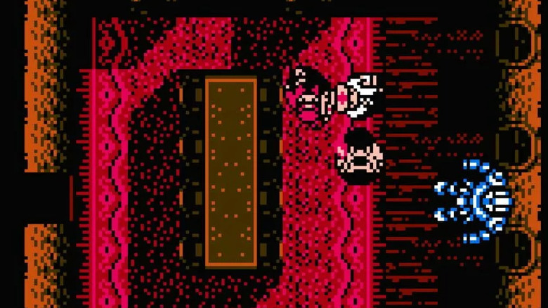 A character examines a suit of armor in Sweet Home