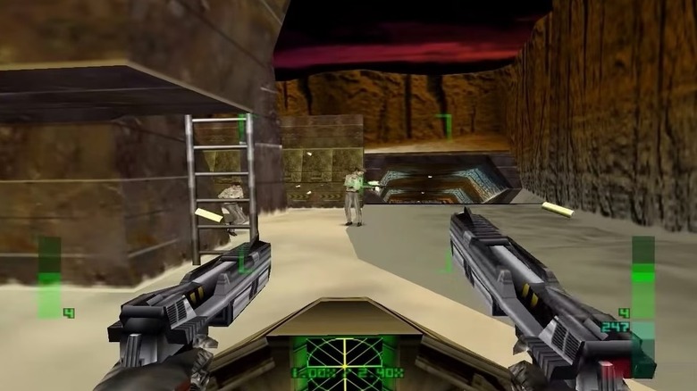 Joanna Dark aims two pistols at an enemy soldier in Perfect Dark