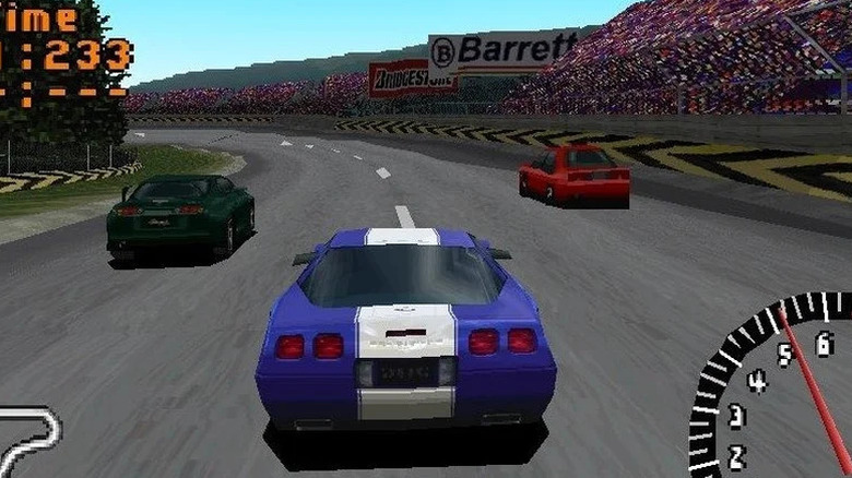 A blue race car approaches two rivals around a corner in "Gran Turismo" (1997)