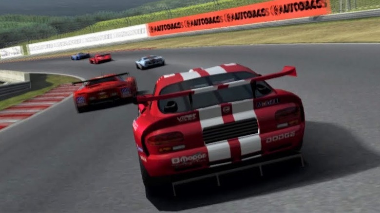 A red Dodge follows a group of race cars around a corner in Gran Turismo 3: A-Spec