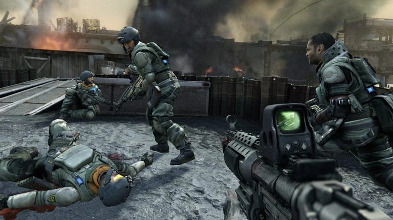 Soldiers take cover in a burning city in Killzone 2