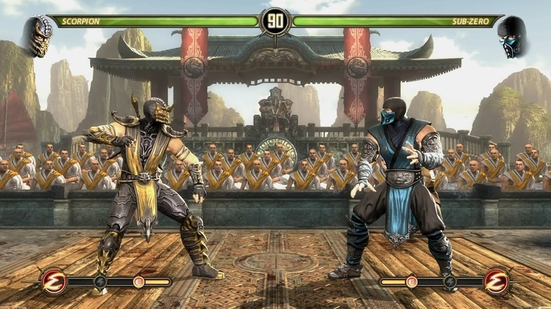 Scorpion faces Sub-Zero as monks watch in Mortal Kombat (2011)