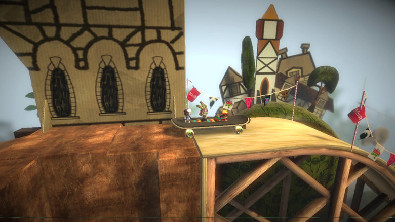 Sackboys on a skateboard ride down a ramp in LittleBigPlanet