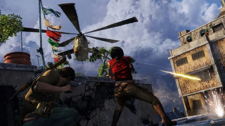 Nathan Drake and Chloe Frazer take cover from an attacking helicopter in Uncharted 2: Among Thieves