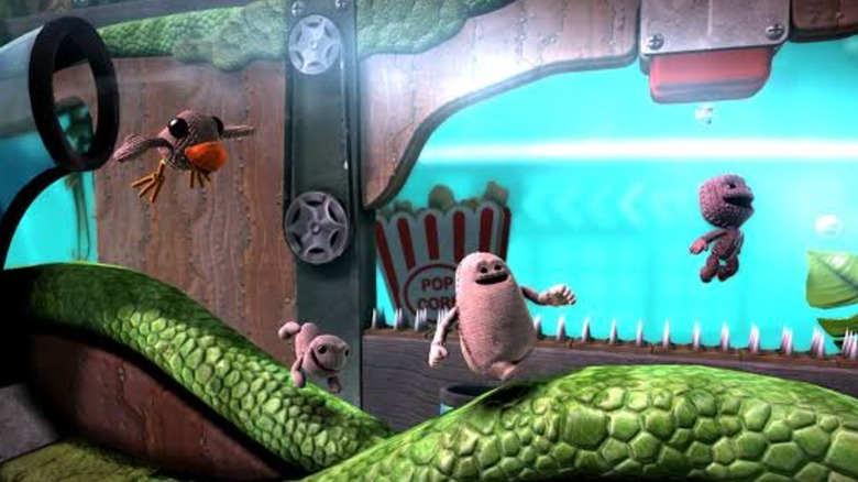 Sackboy jumping through map in "Little Big Planet 3" (2014)