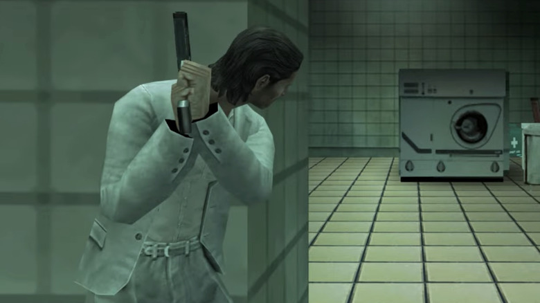 Crockett peeking around a wall with his gun drawn in Miami Vice on PSP
