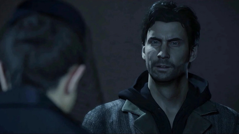 Alan Wake speaks to a man at night in "Alan Wake Remastered" (2021)