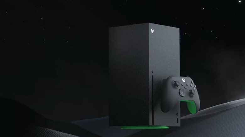 A black Xbox Series X and a controller sit on a black background