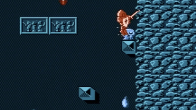 An armored Kuros climbs a rock wall in "Wizards & Warriors" (1987)