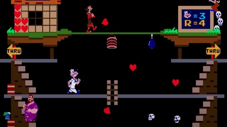 Popeye strides under Olive Oyl and above Bluto on a platform with hearts in Popeye
