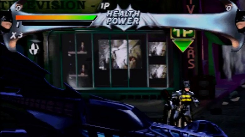 Batman stands by the Batmobile in "Batman Forever: The Arcade Game" (1996)