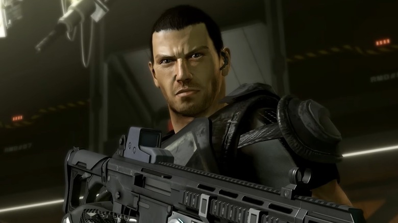 Dan Marshall, the lead character of Binary Domain, standing with his gun at the ready