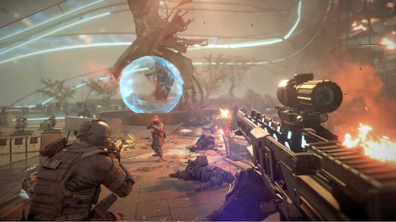 A squad of soldiers advance on an enemy in a futuristic city in Killzone Shadow Fall