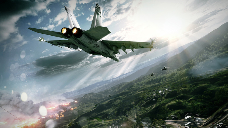 Fighter jets soar over a forested landscape in Battlefield 3