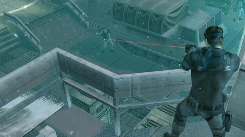Solid Snake aims down at an enemy soldier in Metal Gear Solid: The Twin Snakes