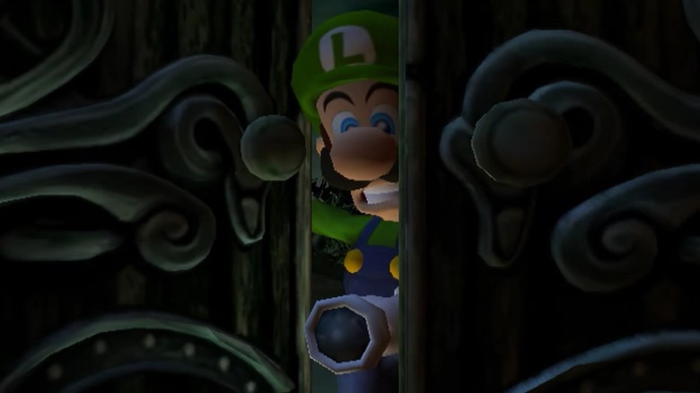 Luigi opening the doors to the mansion in Luigi's Mansion for GameCube