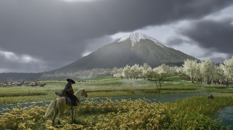 Atsu riding a horse near a mountain in Ghost of Yotei (2025)