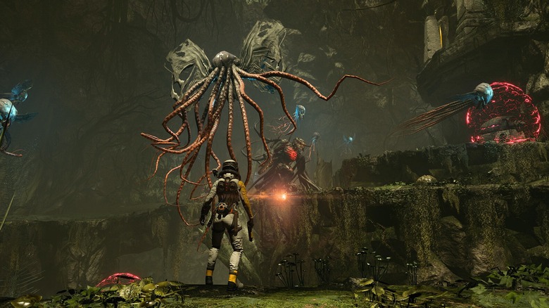 The player facing alien creatures in Returnal (2021)
