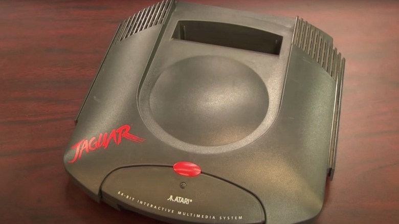 An Atari Jaguar sits on a wooden table