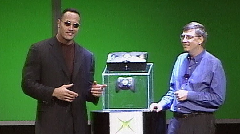 Dwayne Johnson and Bill Gates present the Xbox on stage